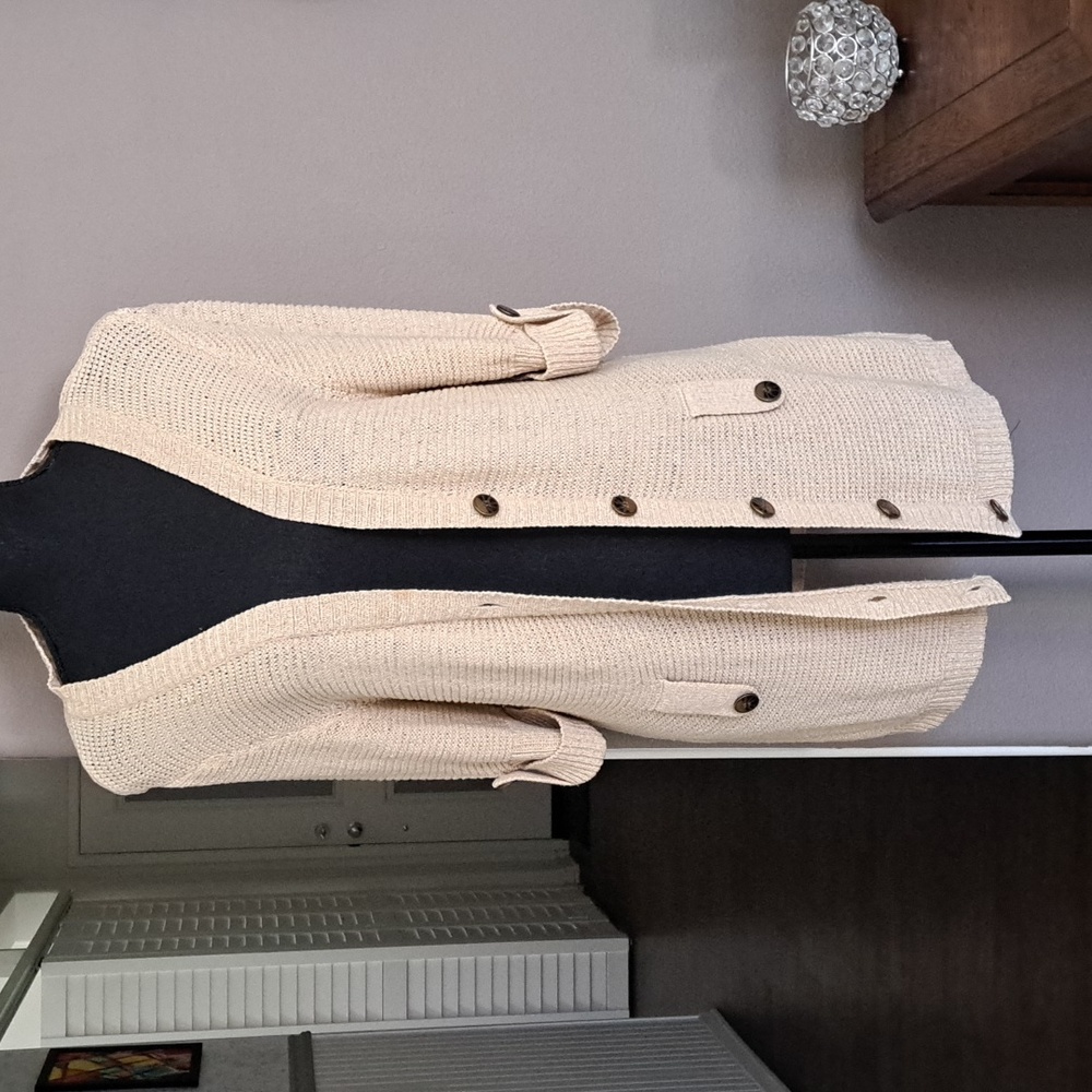70s vibe lightweight button-up cardigan  that's 19 inches long in Size Large.
